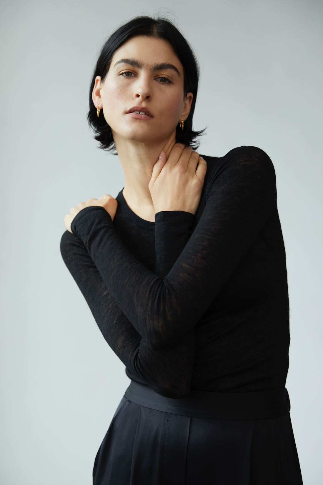 Model wears i seira pod drop earrings in collaboration with brand, frances de lourdes