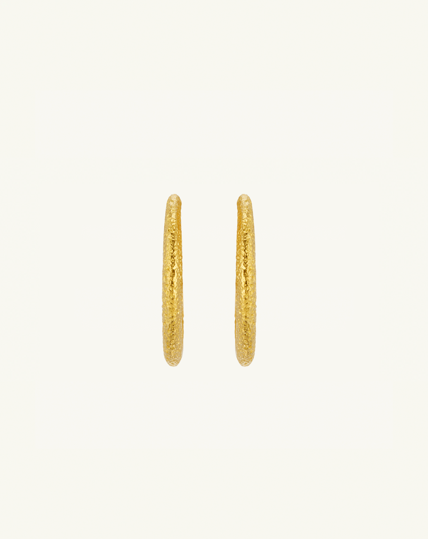 Straight on product image of the large asymmetric hoops with textured gold 