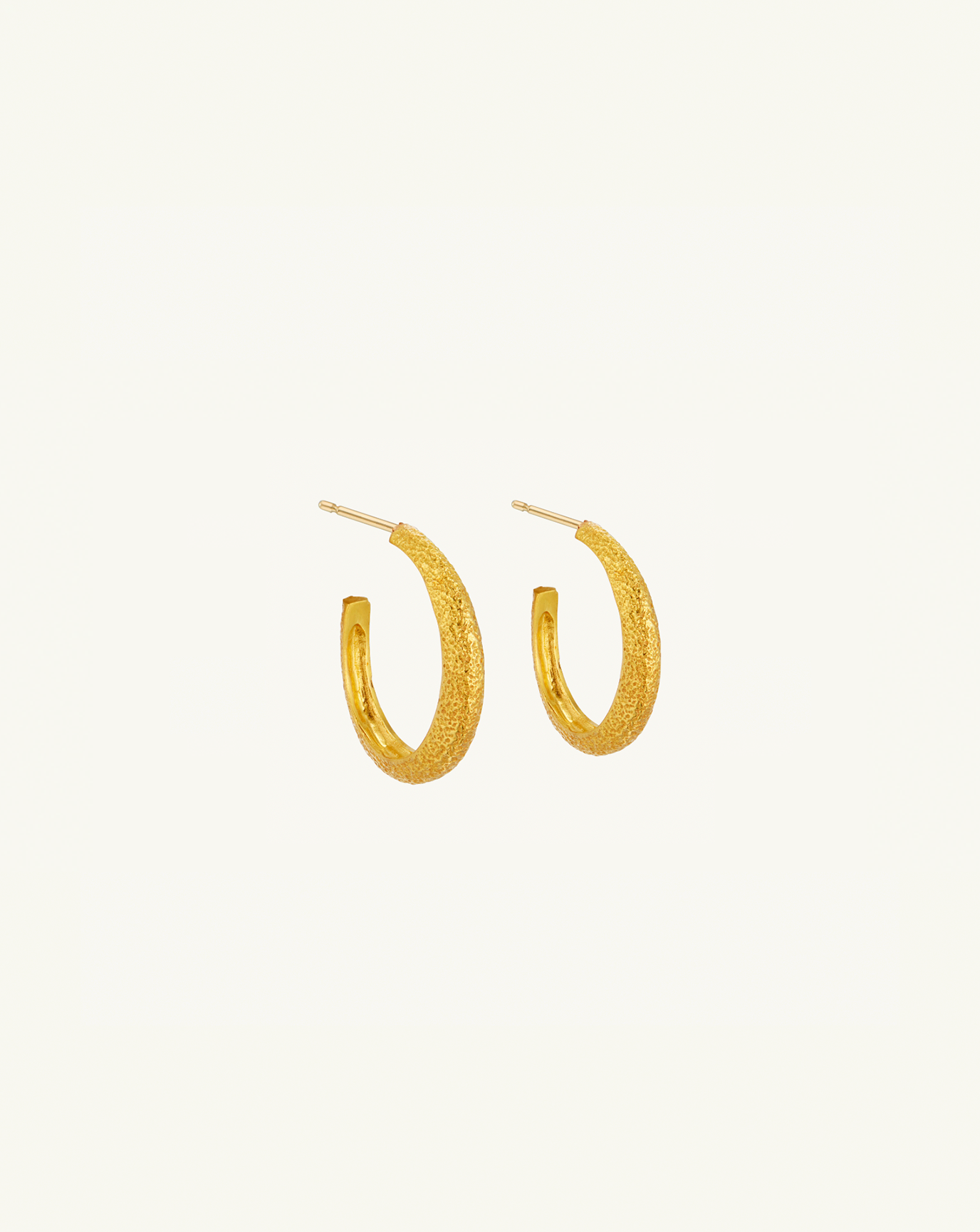 Product image of the medium sized asymmetric hoops with textured gold