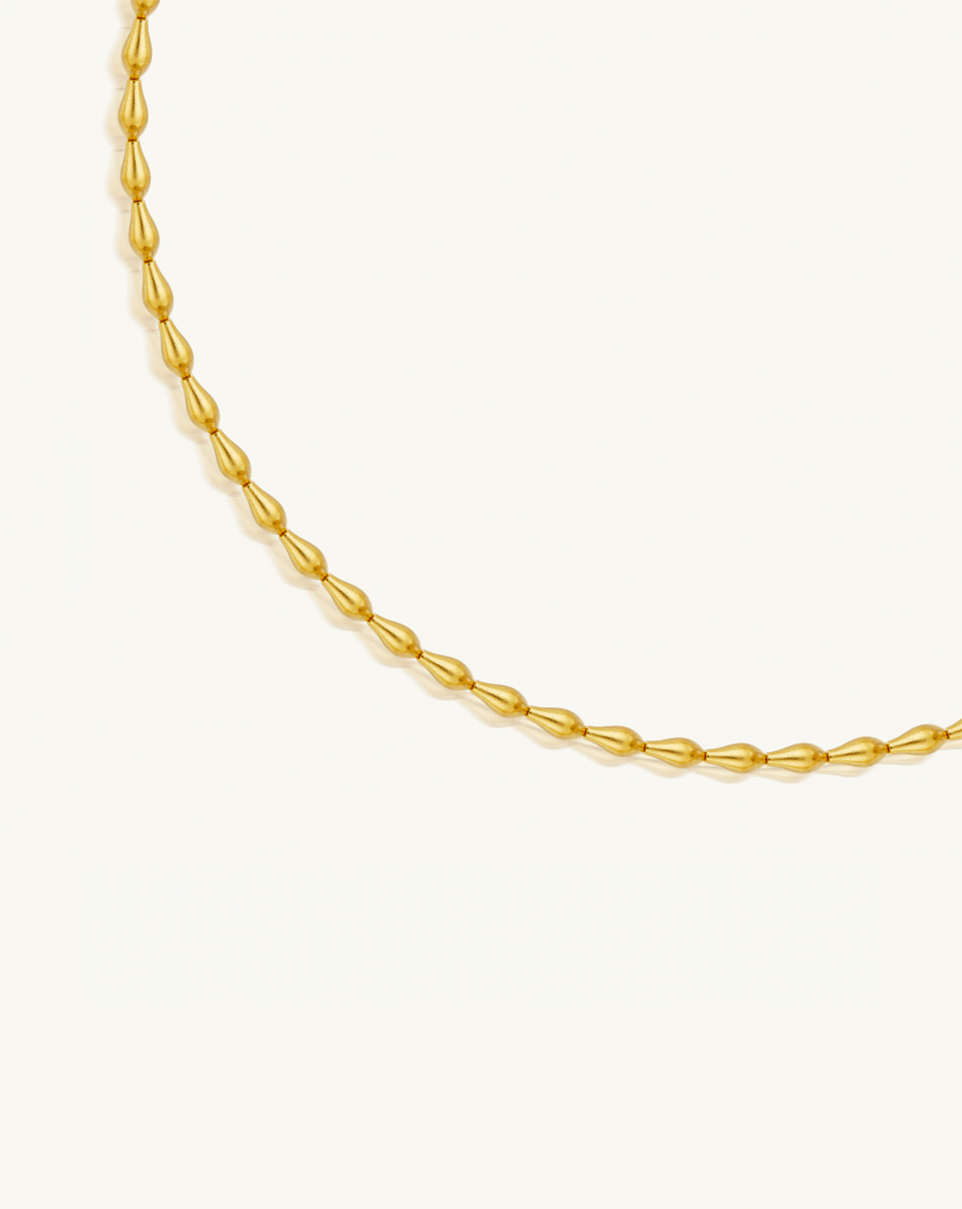 Close up product image of the pod necklace with gold pod beads