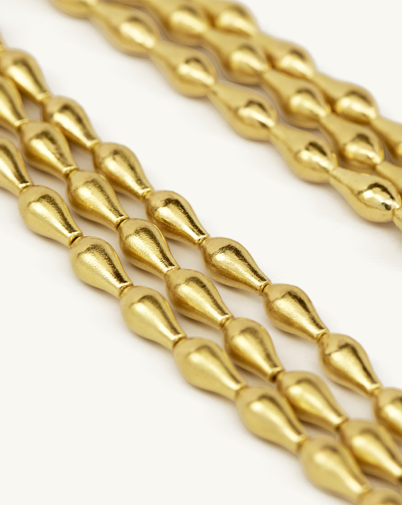 Close up product image of i seira gold pod necklace