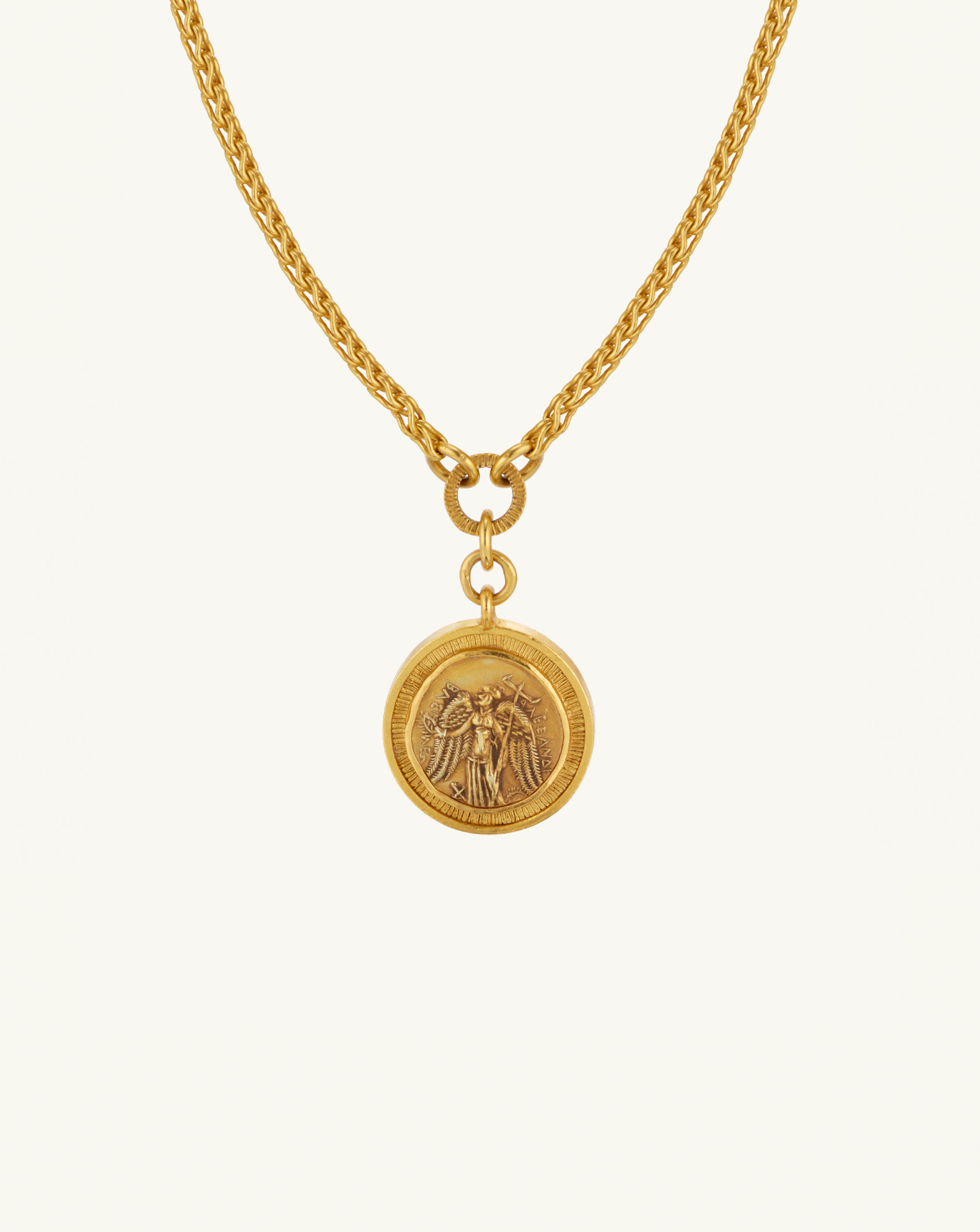 Product image of the reversible coin pendant with a chain