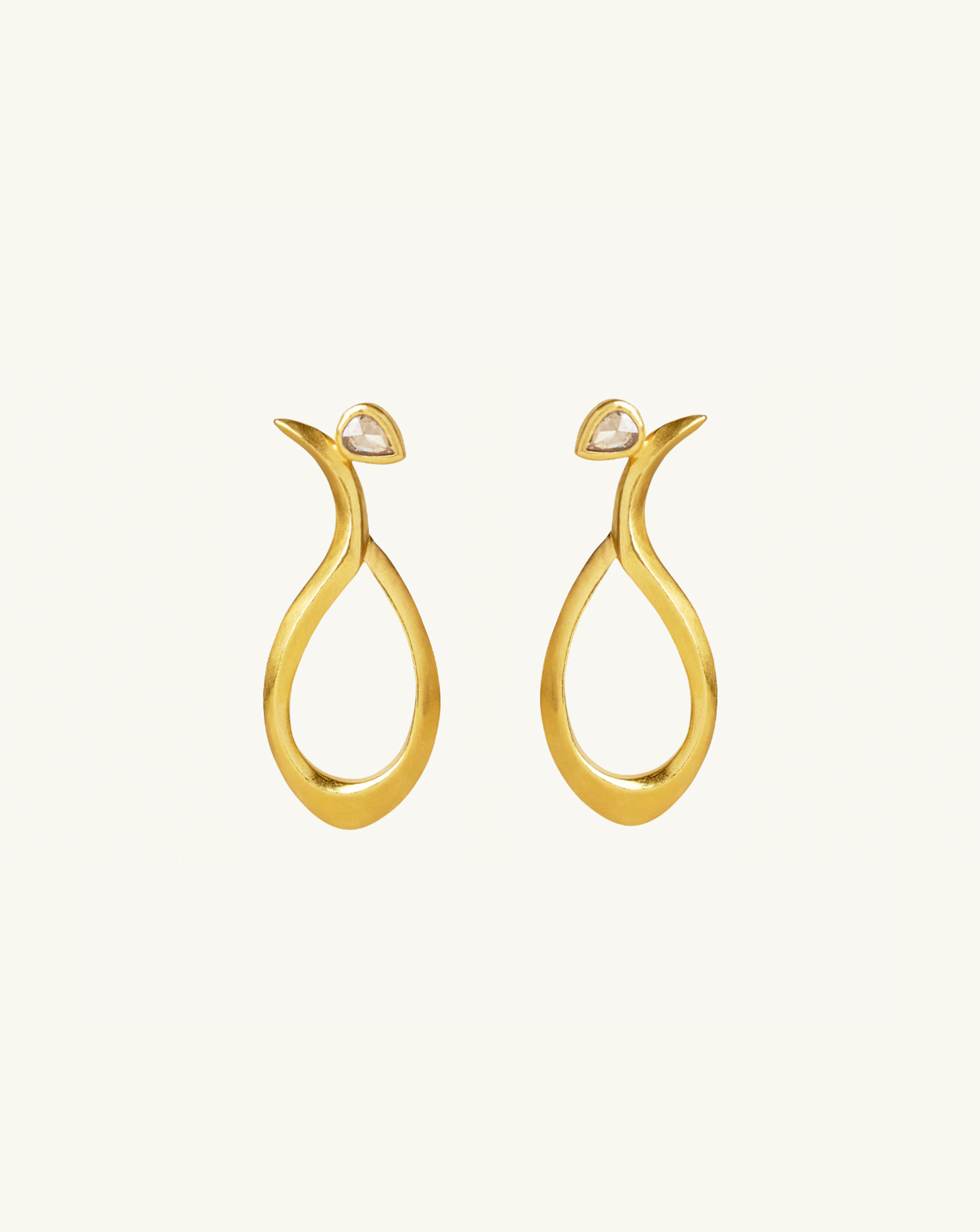 Product image of the large sculptural earrings with small white diamonds