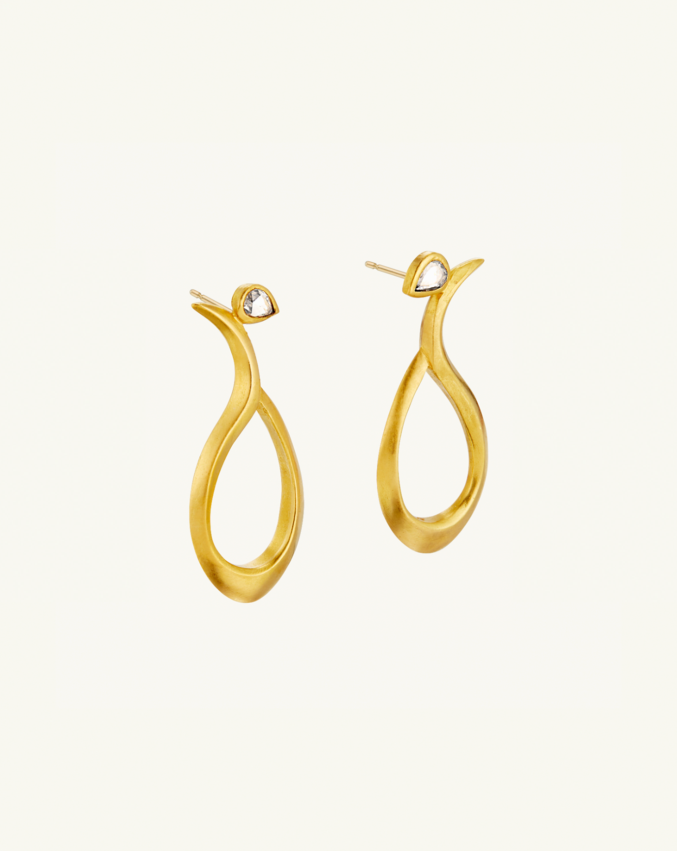 Product image of the sculptural gold earrings with small teardrop diamonds