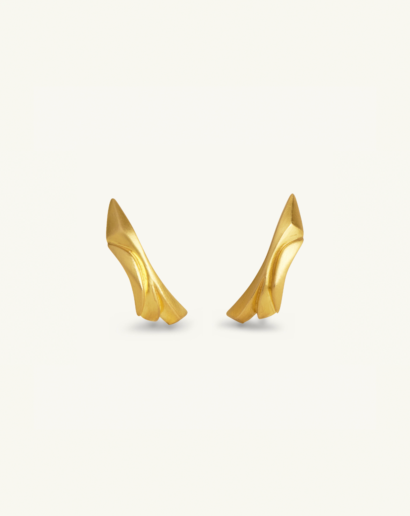 Product image of the sculptural earrings in gold