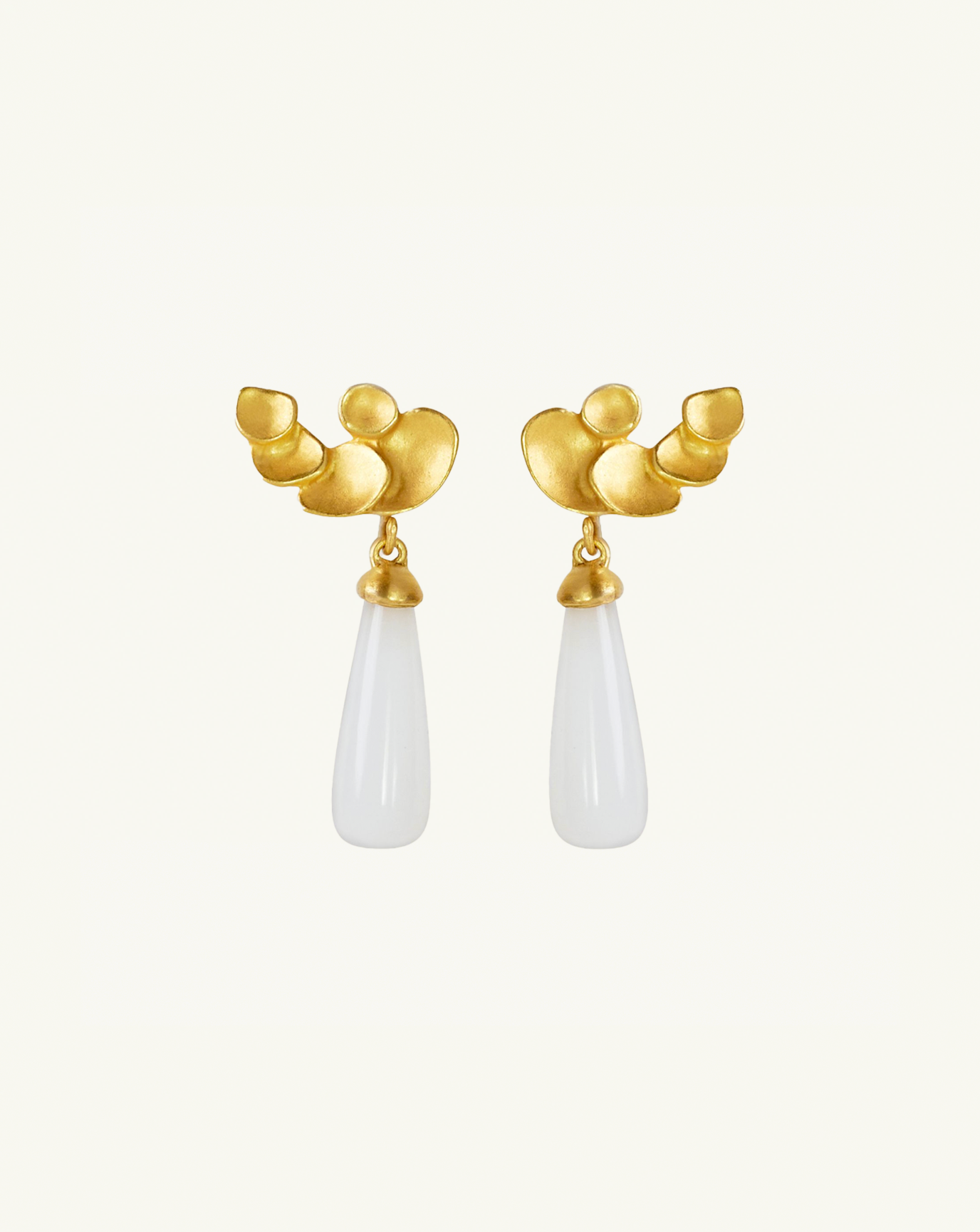 Product image of the white moonstone drop earrings with the large abstract climber studs attached