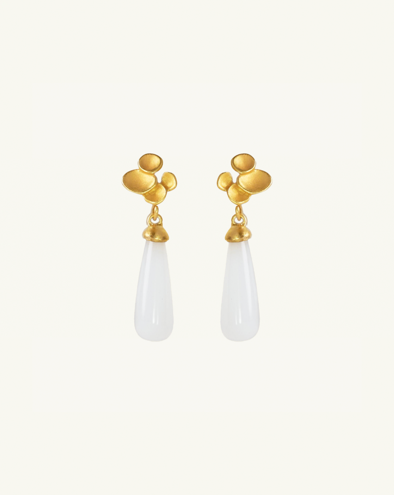 Product image of the white moonstone drop earrings with abstract climber studs attached