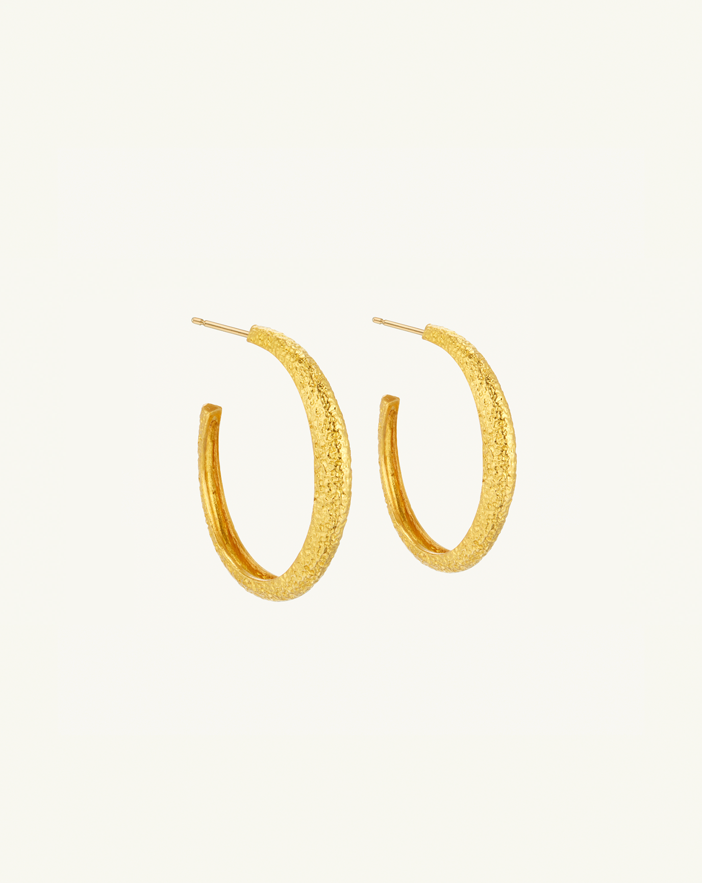 Product image of the large asymmetric hoops with textured gold