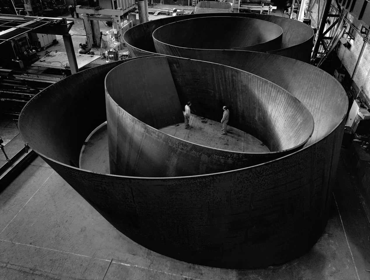 Black and white image of a Richard Serra art sculpture