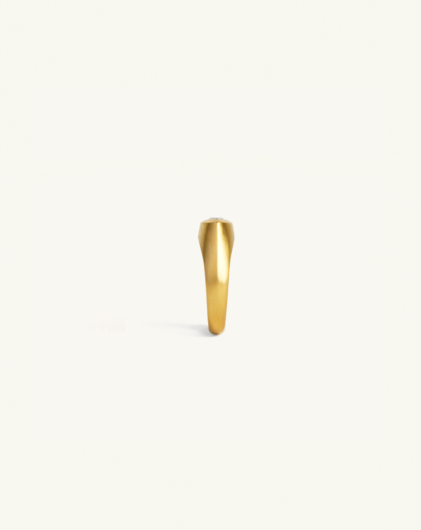 Product image of the sculptural ring in gold with diamond centre