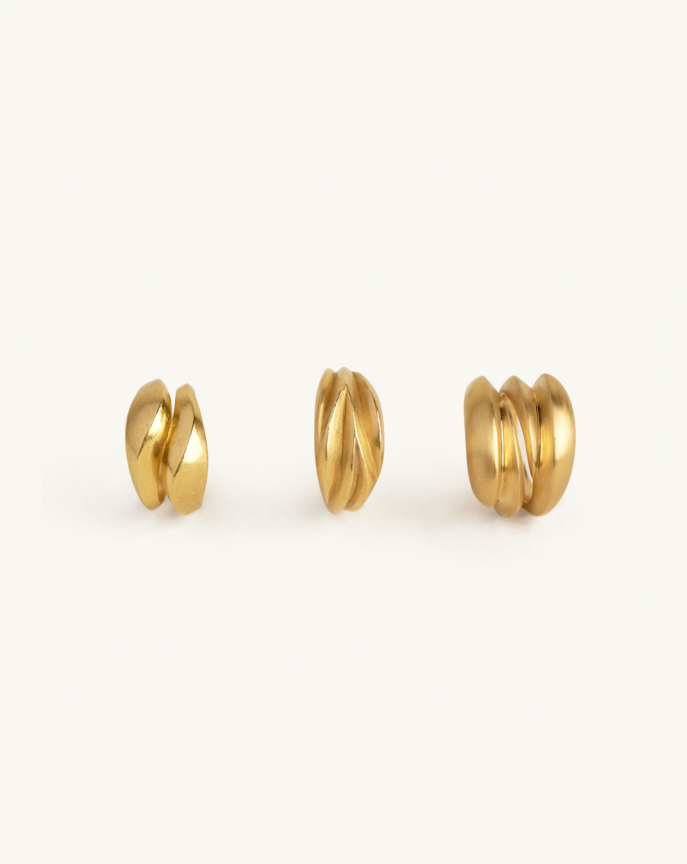 Group product image of the three sculptural rings in gold