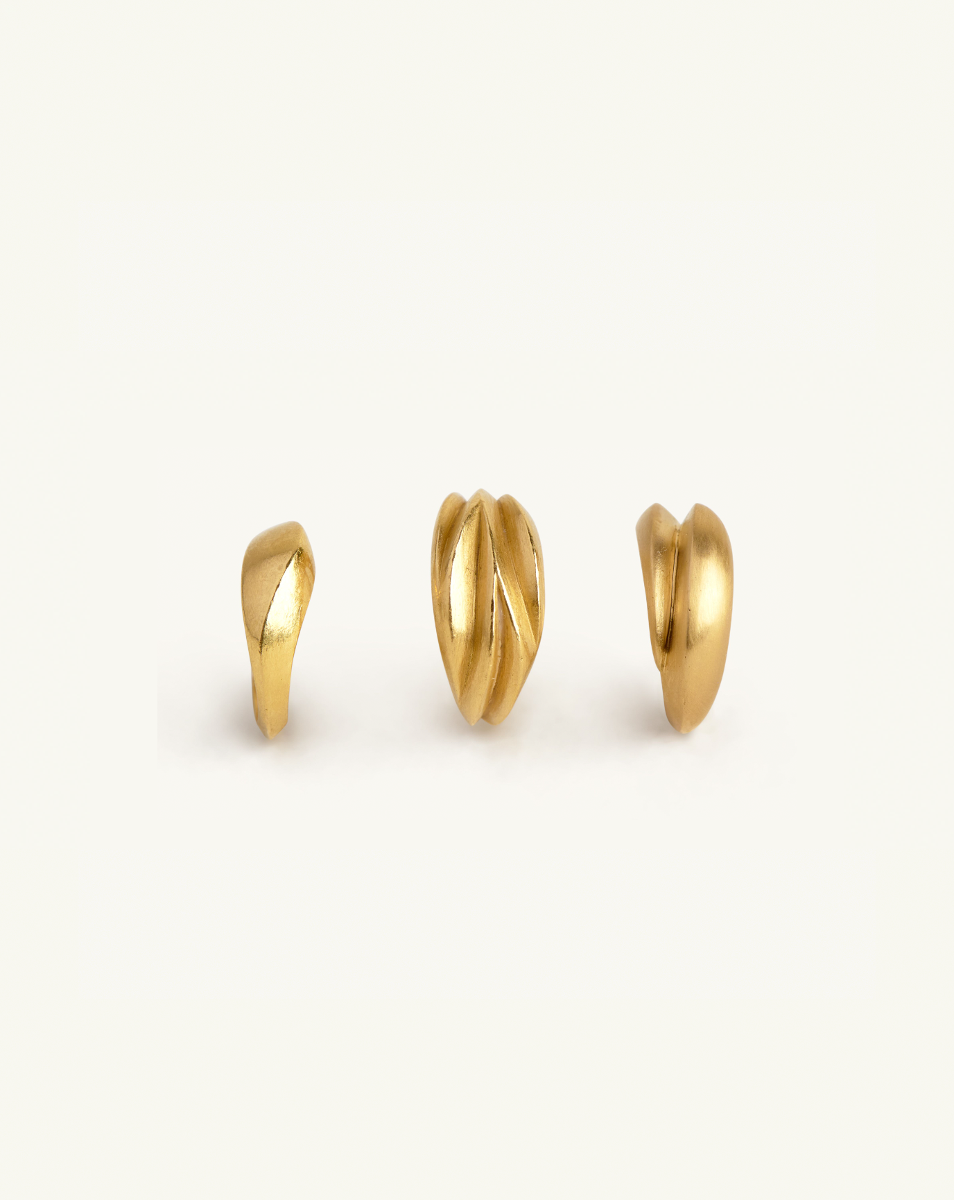 Group product image of the three sculptural rings in gold
