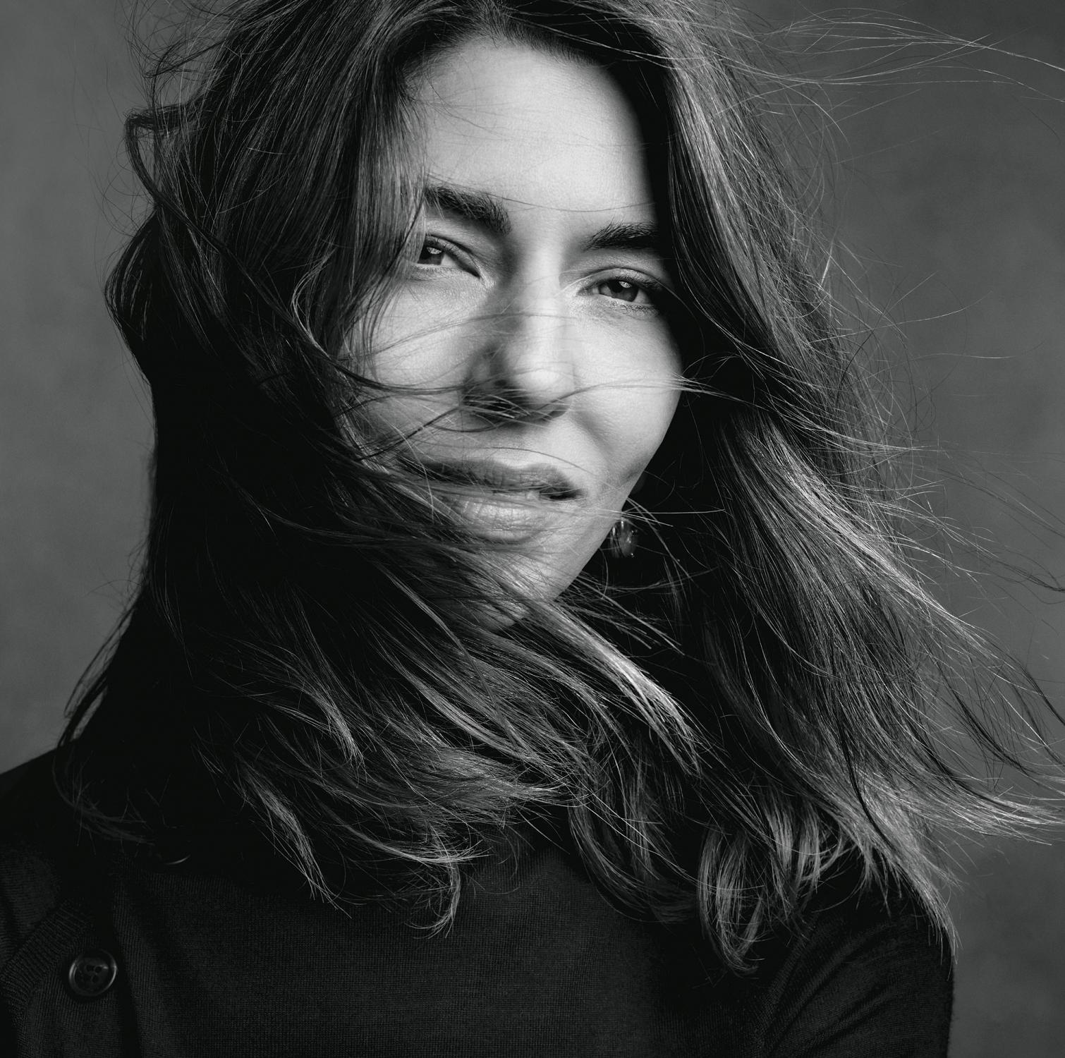 Black and white image of Sofia Coppola with windswept hair.