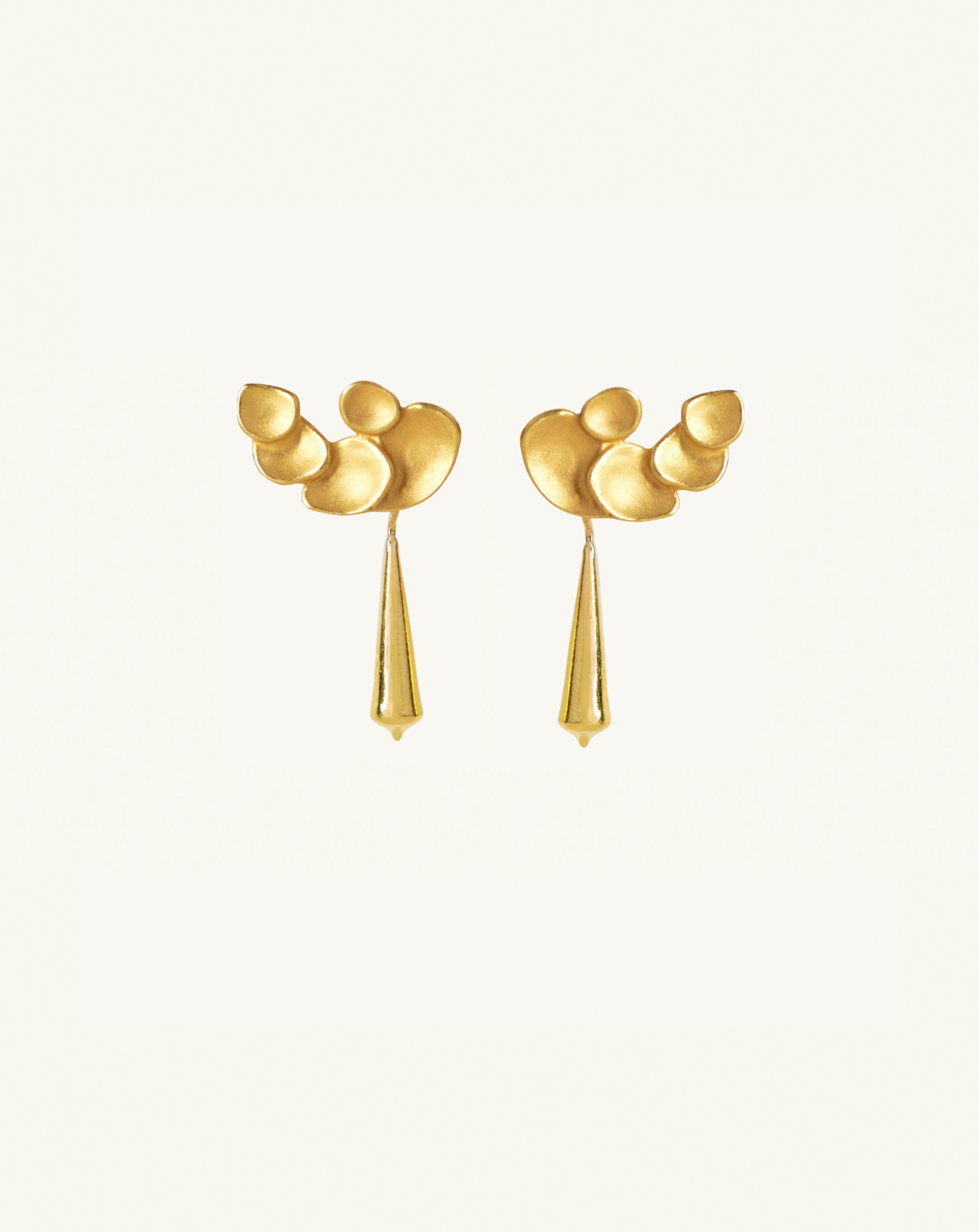 Product image of the tapered gold pod earrings with the large abstract climber studs attached